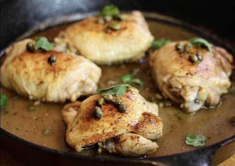sous vide chicken piccata in a cast iron skillet