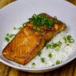 sous vide salmon with ginger miso glaze on a bed of rice