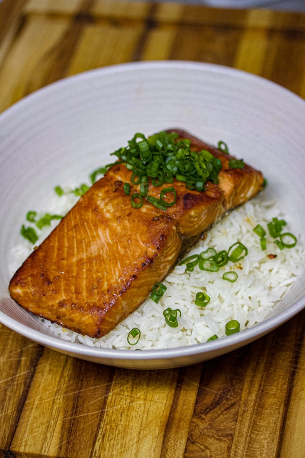 sous vide salmon with ginger miso glaze on a bed of rice