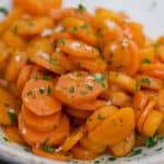 glazed carrots in bowl with flake salt