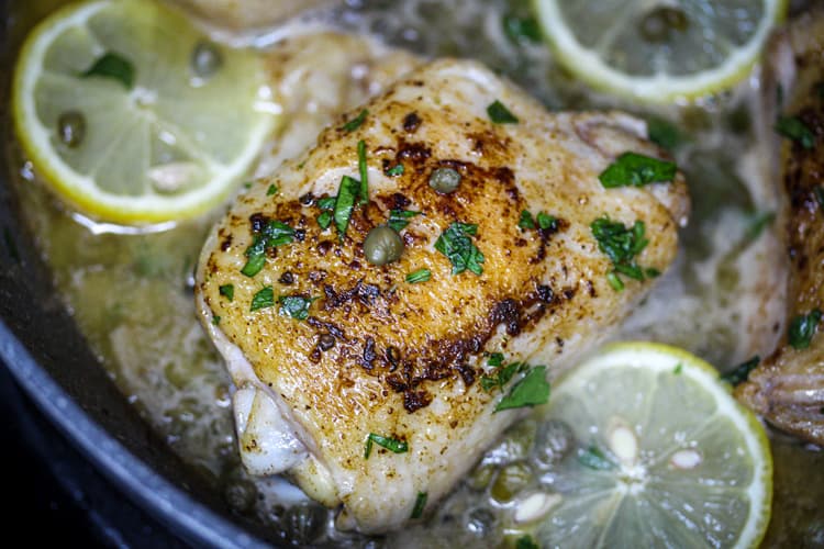 Close up Sous vide chicken thigh piccata in pan