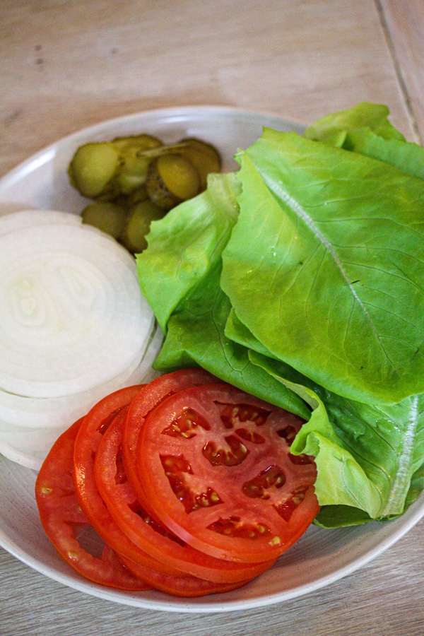 burger toppings lettuce, onion, pickles, tomato